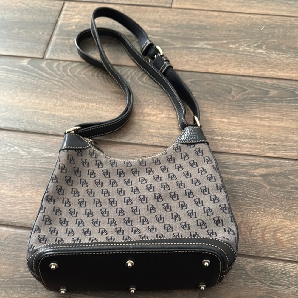 Dooney & Bourke Black Shoulder Bag with Bucket Shape and Adjustable Strap